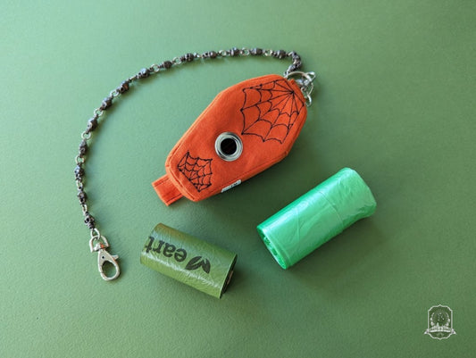 handmade coffin poop bag holder with embroidered spider webs