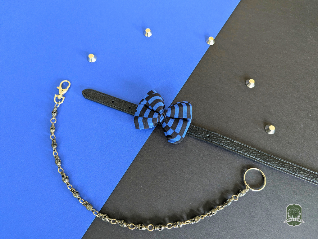 Blue and black Checkerboard pet bow tie on a black leather collar
