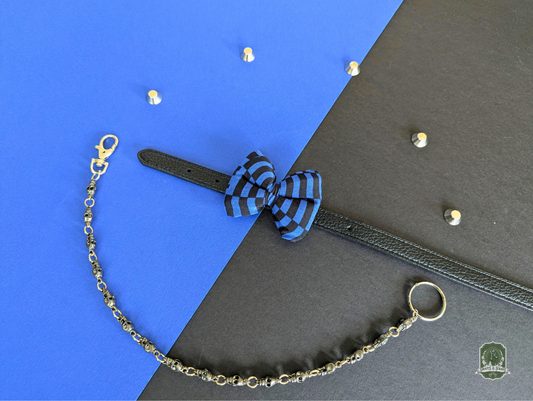 Blue and black Checkerboard pet bow tie on a black leather collar