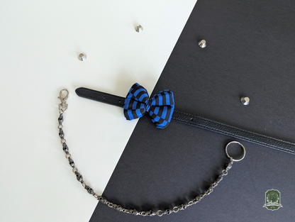 Blue and black Checkerboard pet bow tie on a black leather collar