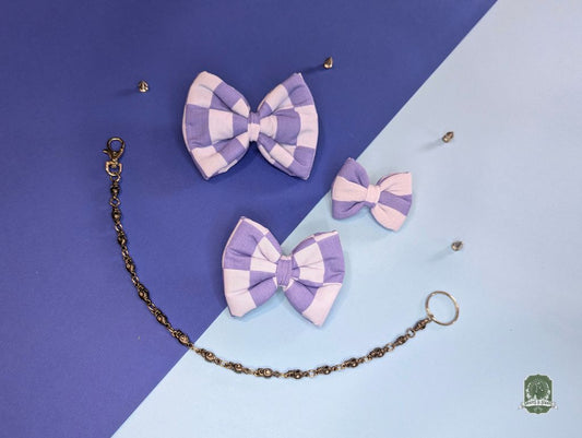 Set of 3 Pastel blue and light blue checkered dog bow ties with decorative chain on a blue and two-tone background