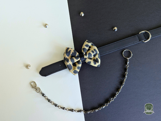 Leopard print pet bow tie on a white and black background