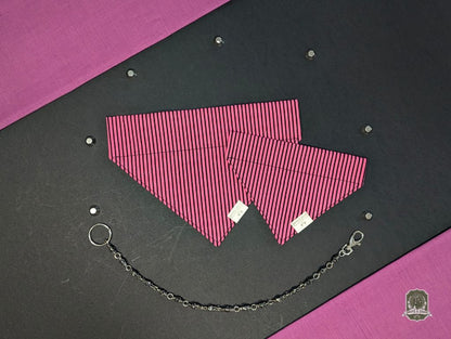 Pink and black striped dog bandana that slides onto a collar, with decorative chain on a black and pink background with bat decorations