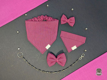 Pink and black striped bow tie set on a gray and pink background